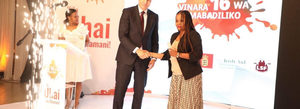 Zaituni Receiving award from Ambassador of Switzerland in Tanzania